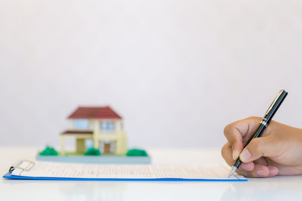 Cesión de remate: guía completa para entender su proceso legal 2 Firma de registro de propiedad de una casa